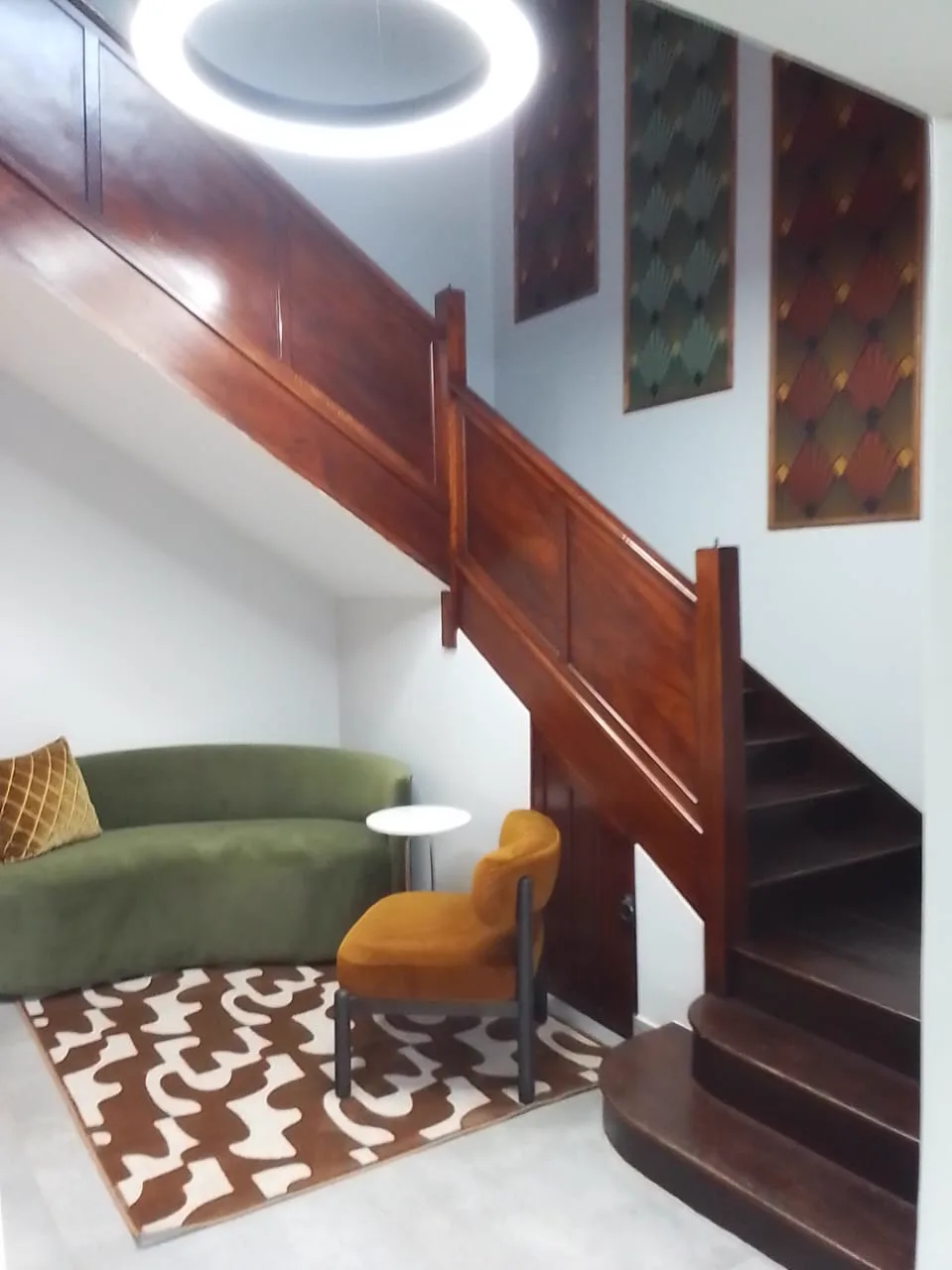 13 Private Road lounge seating area beneath the staircase