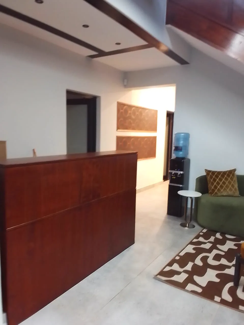 13 Private Road reception counter with lounge seating and water station