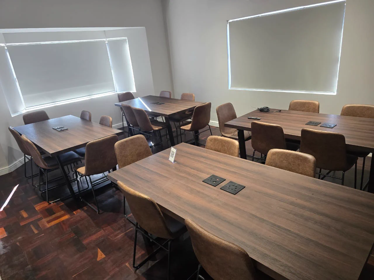 13 Private Road training room with tables, chairs and window blinds