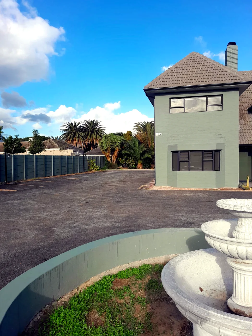 Private Street exterior with driveway and planted beds