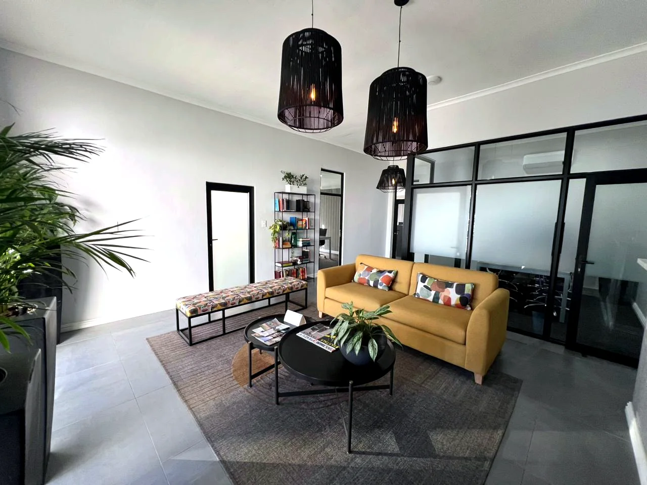 Private Street reception lounge with seating and glass office partitions