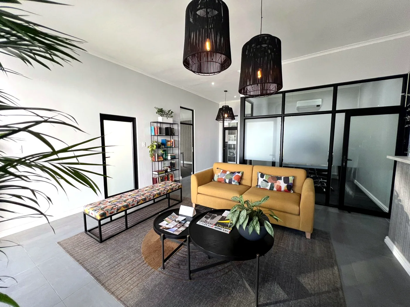 Private Street reception and waiting area with seating and plants